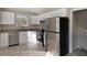 Modern kitchen featuring stainless steel appliances and white cabinets at 1761 Derrill Dr, Decatur, GA 30032