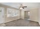 Spacious living area with neutral decor, large windows, and ceiling fan at 1761 Derrill Dr, Decatur, GA 30032