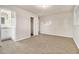 Bright bedroom with carpet, en-suite bathroom access, and closet at 2372 Tyler Way, Decatur, GA 30032