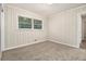 Spacious bedroom featuring wood paneling and carpet at 2372 Tyler Way, Decatur, GA 30032