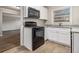 Well-equipped kitchen with black appliances and white cabinets at 2372 Tyler Way, Decatur, GA 30032