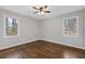 Well-lit bedroom with hardwood floors and ceiling fan at 345 Shannon Way, Lawrenceville, GA 30044