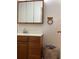 Bathroom featuring a white sink, toilet and accessible shower with grab bars at 35 Fairfield Dr, Ellenwood, GA 30294