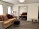 Bright living room with modern flooring and a cozy seating area with natural light at 35 Fairfield Dr, Ellenwood, GA 30294