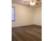 Clean bedroom with hardwood floors, white walls, and natural light at 35 Fairfield Dr, Ellenwood, GA 30294
