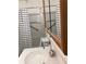 Bathroom with wood-look flooring, neutral walls, vanity with sink, and open door at 35 Fairfield Dr, Ellenwood, GA 30294