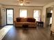 Comfortable living room with modern flooring, neutral paint, and ample natural light at 35 Fairfield Dr, Ellenwood, GA 30294