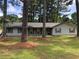 Charming single-story home with a welcoming front yard and mature trees at 35 Fairfield Dr, Ellenwood, GA 30294