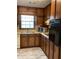 Traditional kitchen featuring wood cabinets, laminate countertops, and appliances at 35 Fairfield Dr, Ellenwood, GA 30294