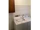 Functional laundry area with white washer and dryer, and wire shelving at 35 Fairfield Dr, Ellenwood, GA 30294