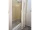 Bathroom featuring a wood vanity and white countertop with a large framed mirror at 35 Fairfield Dr, Ellenwood, GA 30294