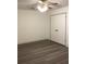 Classic bedroom featuring wood-look flooring, neutral walls, and a ceiling fan at 35 Fairfield Dr, Ellenwood, GA 30294