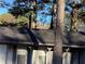 Covered front porch with grey pillars, offering shade and curb appeal at 35 Fairfield Dr, Ellenwood, GA 30294