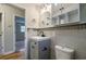 Clean bathroom with gray vanity, and updated tile at 5310 Timbo Ln, Mableton, GA 30126