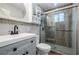 Updated bathroom with gray vanity, walk-in shower, and modern fixtures at 5310 Timbo Ln, Mableton, GA 30126
