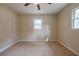 Well-lit bedroom with new carpet and ceiling fan at 5310 Timbo Ln, Mableton, GA 30126