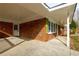 Covered porch with brick columns and concrete flooring at 5310 Timbo Ln, Mableton, GA 30126
