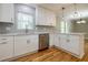Modern kitchen with white cabinets, quartz countertops, and stainless steel appliances at 5310 Timbo Ln, Mableton, GA 30126
