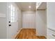 Bright laundry room with wood floors and built in cabinets at 5310 Timbo Ln, Mableton, GA 30126