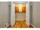 Laundry area with wood floors and upper cabinets at 5310 Timbo Ln, Mableton, GA 30126