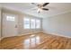 Living room with hardwood floors, fresh paint, and ceiling fan at 5310 Timbo Ln, Mableton, GA 30126