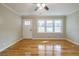 Living room with hardwood floors, fresh paint, and ceiling fan at 5310 Timbo Ln, Mableton, GA 30126