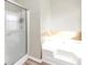 Relaxing bathroom with a soaking tub and a walk-in shower at 6543 Woodwell Dr, Union City, GA 30291