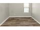 Bedroom with window and wood-look floors at 6543 Woodwell Dr, Union City, GA 30291