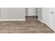 Hallway with wood-look floors and doors at 6543 Woodwell Dr, Union City, GA 30291