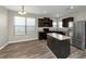 Kitchen features granite countertops and dark brown cabinets at 6543 Woodwell Dr, Union City, GA 30291