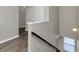 View of a staircase with light gray walls and wood-look flooring at 6543 Woodwell Dr, Union City, GA 30291