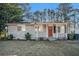 Ranch style home with red front door and landscaped yard at 2040 Forrest Park Se Rd, Atlanta, GA 30315