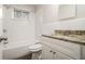 Updated bathroom with granite countertop and white vanity at 3395 Springlake Dr, Decatur, GA 30032
