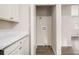 Convenient laundry closet in the kitchen area at 3395 Springlake Dr, Decatur, GA 30032