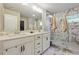 Elegant bathroom with double vanity, marble shower, and ample storage at 667 Crosshaven Dr, Marietta, GA 30066