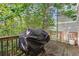 Private deck with a covered grill, perfect for outdoor entertaining at 667 Crosshaven Dr, Marietta, GA 30066