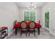 Bright dining room features a large table with seating for six and access to a deck at 667 Crosshaven Dr, Marietta, GA 30066