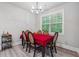 Dining room with a red tablecloth and chandelier at 667 Crosshaven Dr, Marietta, GA 30066