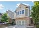 Two-story home with gray siding and a two-car garage at 667 Crosshaven Dr, Marietta, GA 30066