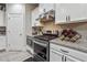 Modern kitchen with stainless steel appliances and white cabinets at 667 Crosshaven Dr, Marietta, GA 30066