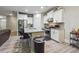 Kitchen boasts granite countertops and white cabinets at 667 Crosshaven Dr, Marietta, GA 30066