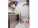 Convenient laundry room with washer, dryer, and storage shelves at 667 Crosshaven Dr, Marietta, GA 30066