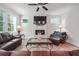 Living room featuring a fireplace and leather sofas at 667 Crosshaven Dr, Marietta, GA 30066