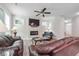 Open living room with fireplace and leather seating at 667 Crosshaven Dr, Marietta, GA 30066