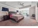Large main bedroom with a king-size bed, ceiling fan, and en-suite bathroom at 667 Crosshaven Dr, Marietta, GA 30066