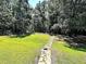 Stone pathway through grassy backyard at 20 Mountain Ridge Ne Rd, White, GA 30184