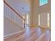 Two-story foyer with hardwood floors and elegant staircase at 3071 Springfair Trott, Lithonia, GA 30038
