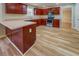 L-shaped kitchen with rich wood cabinets and a spacious layout at 3071 Springfair Trott, Lithonia, GA 30038