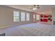 Living room with kitchen view, carpet, and windows at 3071 Springfair Trott, Lithonia, GA 30038