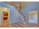 Elegant staircase with wooden railings in a spacious foyer at 3071 Springfair Trott, Lithonia, GA 30038